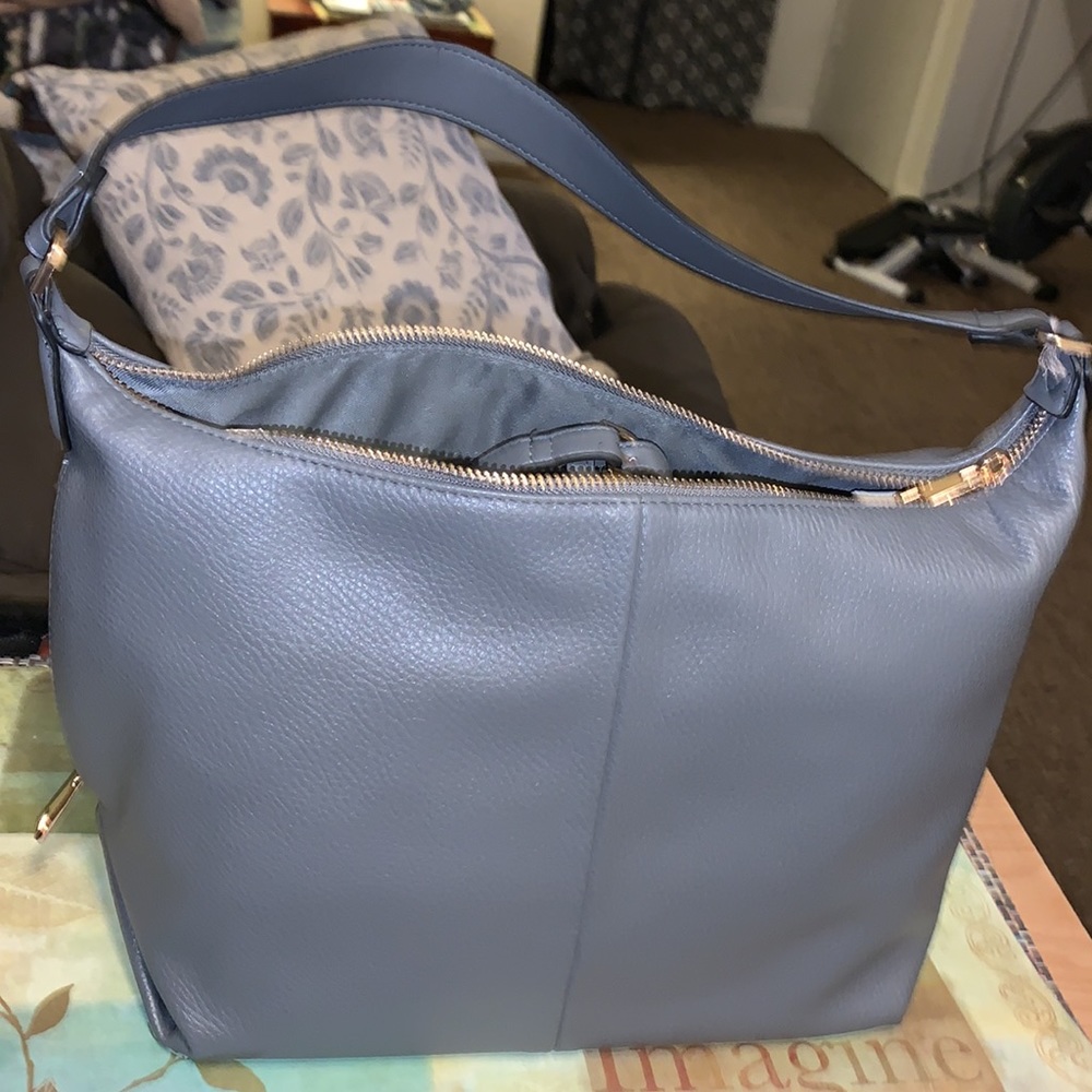 Shoulder bag that turns into a Crossbody bag with extra strap